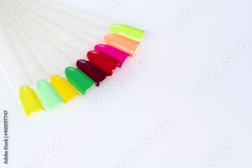 Multiсolor nail tips on a white background. examples of manicure for nails. Palette with color samples of nail. Copy space