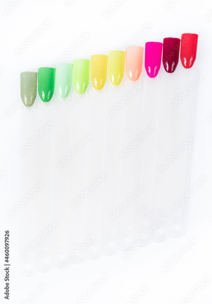 Multiсolor nail tips on a white background. examples of manicure for nails. Palette with color samples of nail. Copy space Multiсolor nail tips on a white background. examples of manicure for nails. Palette with color samples of nail. Copy space