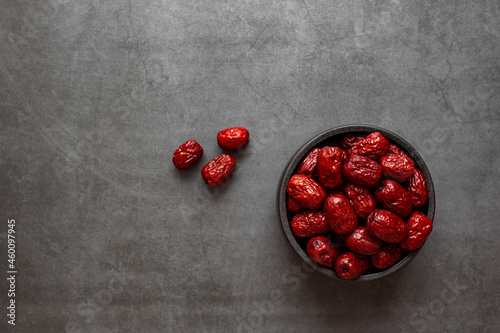 Dried Jujube, Chinese dried red date fruit on dark grey background.