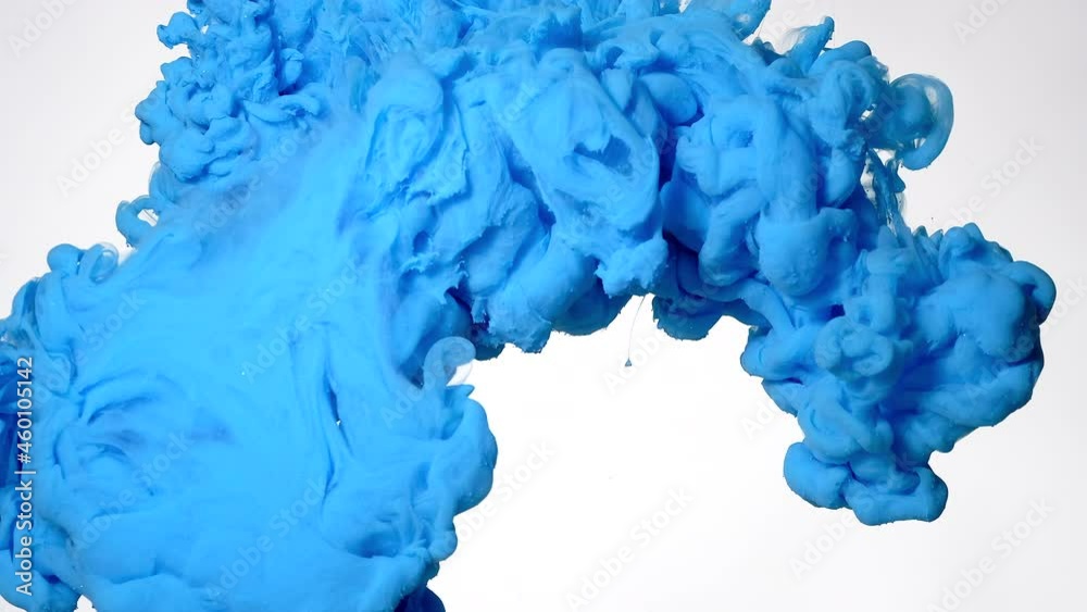 Blue cloud of watercolor ink in water on a white background. Screensaver, relaxing meditative background. Beautiful abstract background. Slow motion of colored acrylic paints in water.