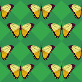 Golden butterflies on green background seamless pattern