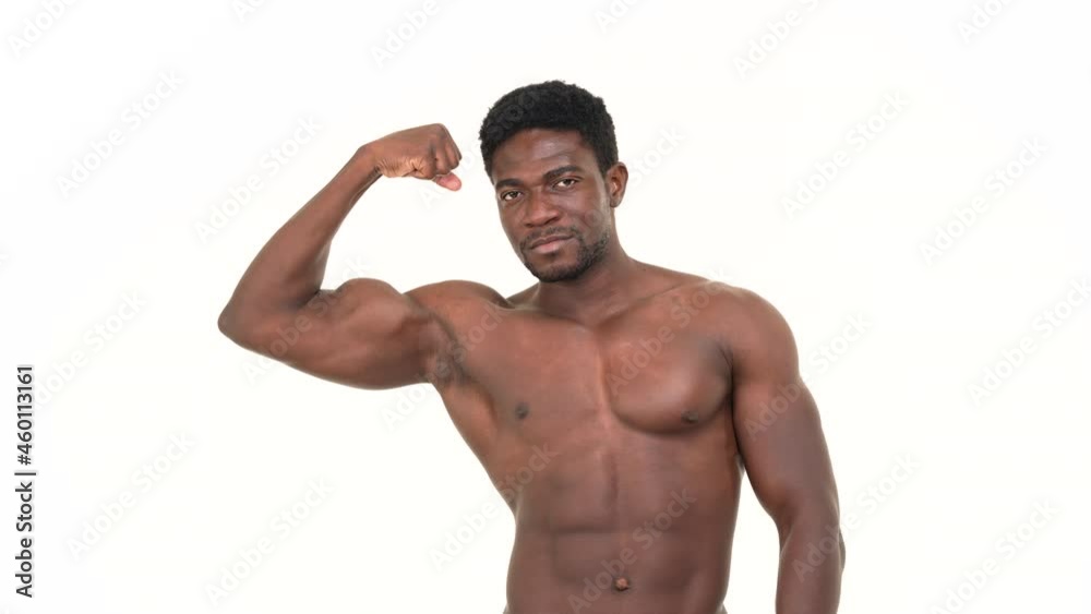 Portrait of an african man flexing one biceps. Isolated on a white background. Portrait of an african man flexing one biceps. Isolated on a white background.