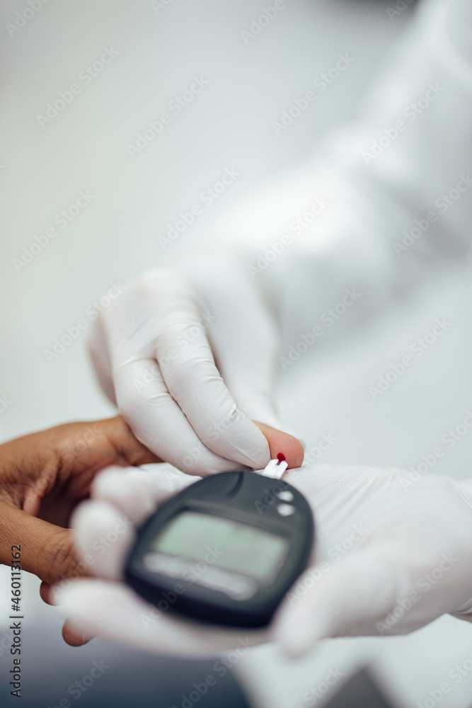 Fototapeta premium Using blood glucose meter, close-up.