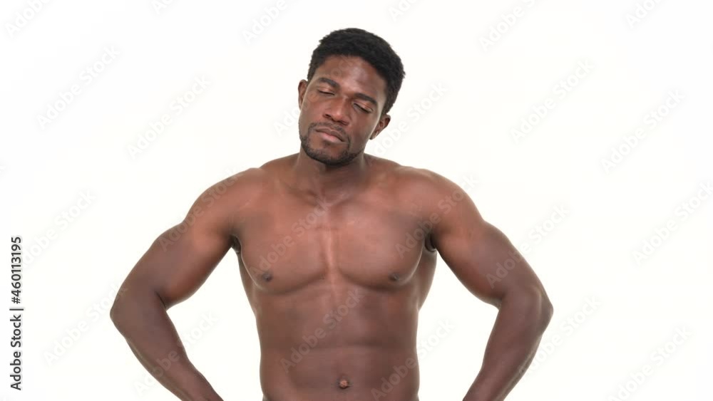 Portrait of a black man cracking his neck. Isolated on a white background.