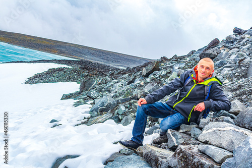 Young hiker at Galdhøpiggen Jotunheimen highest mountain in Norway Scandinavia.