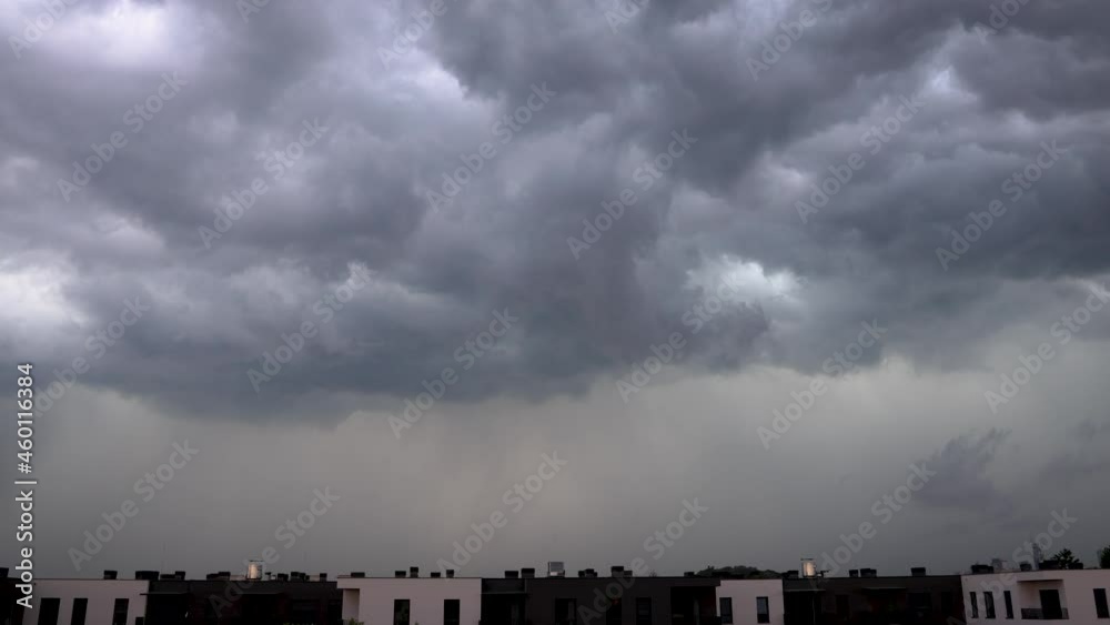 Rainy clouds over apartment houses in Warsaw, Poland, 4k video Rainy clouds over apartment houses in Warsaw, Poland, 4k video