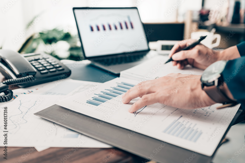 Businessman working on office desk and analyzing new project of accounting finance. Investment, Financial advisor and accounting concept. Businessman working on office desk and analyzing new project of accounting finance. Investment, Financial advisor and accounting concept.