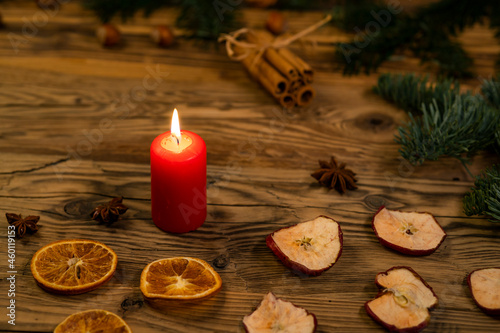 Traditional Czech Christmas on wood decoration with twig  candle  apple  orange  fruit
