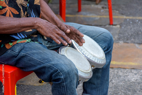 Bongos drum player in the streets of Salvador city during brazilian samba presentation photo
