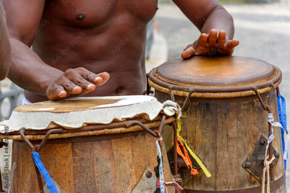 Musician playing atabaque which is a percussion instrument of African  origin used in samba, capoeira, umbanda, candomble and various cultural,  artistic and religious manifestations in Brazil foto de Stock | Adobe Stock