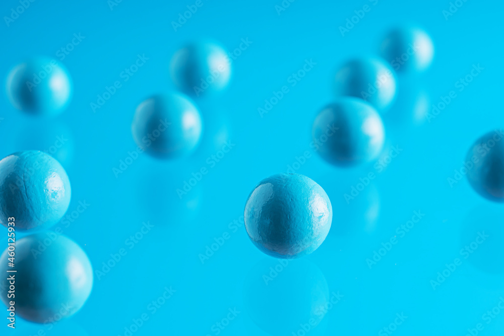Blue balls on blue background. .Abstract background with bright balls Blue balls on blue background. .Abstract background with bright balls