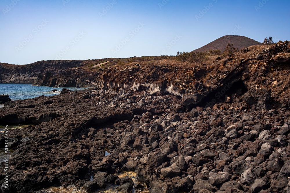 View of the scenic lava rock cliff  in the Linosa island.