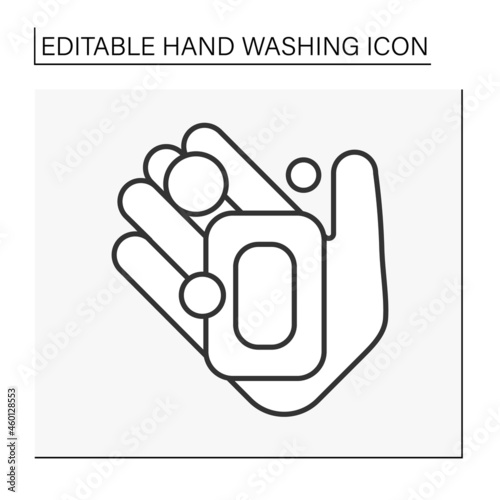  Hand washing line icon. Soap brick on palm. Disinfection. Hygiena concept. Isolated vector illustration. Editable stroke photo