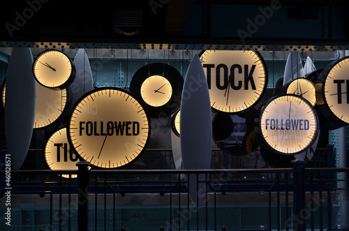 neon clocks with fallowed end tick tock words background 