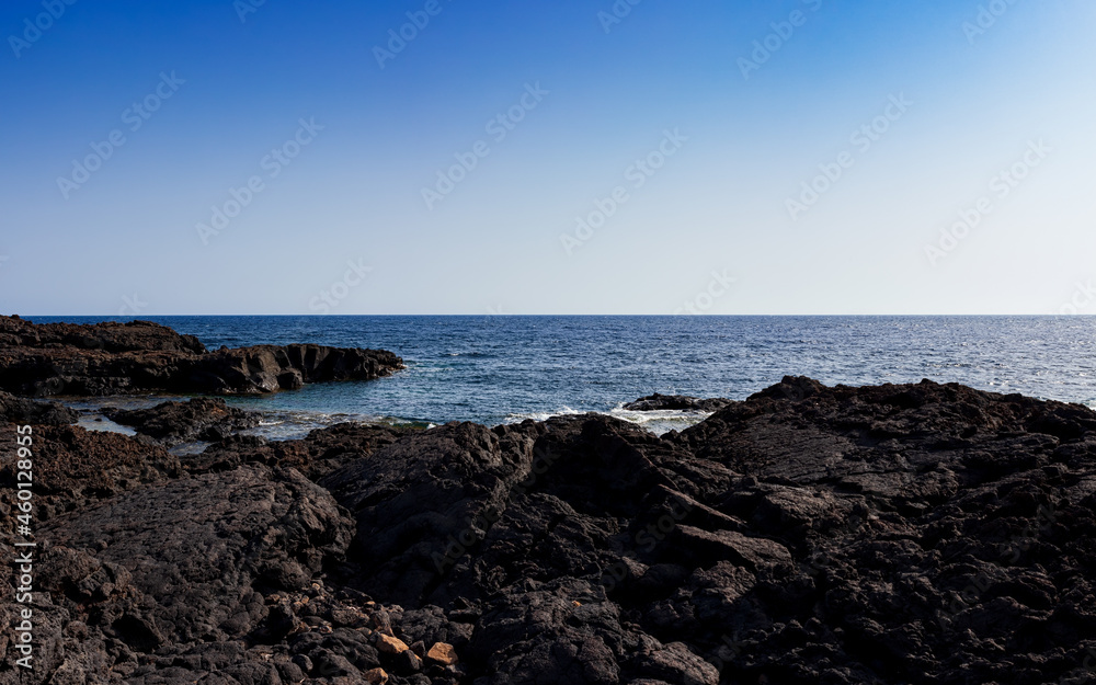 View of the scenic lava rock cliff  in the Linosa island.