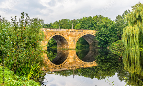 A view towards the Yarm Bridge over the River Tees at Yarm, Yorkshire, UK in summertime photo