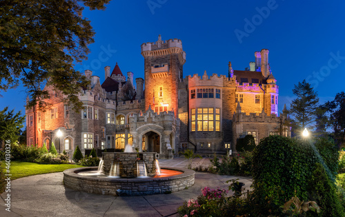 Beautiful Gothic Revival style mansion and fountain at dusk. Toronto Ontario