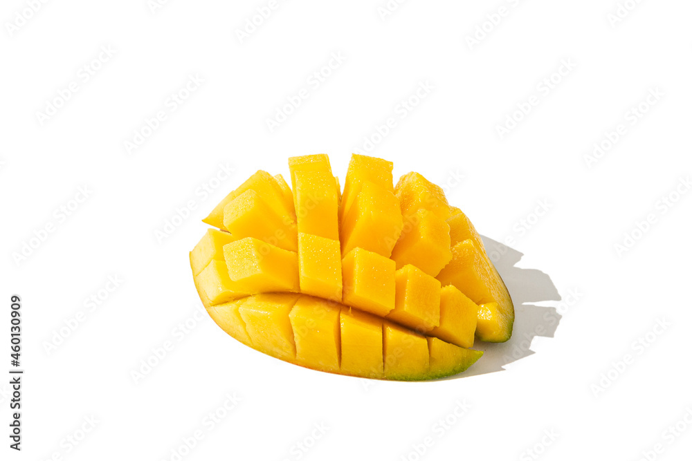 Juicy mango cut in cubes isolated on white background. Side view Juicy mango cut in cubes isolated on white background. Side view