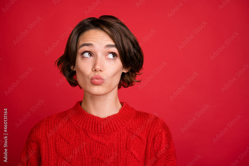 Photo portrait young woman dreamy looking copyspace isolated bright red color background Photo portrait young woman dreamy looking copyspace isolated bright red color background