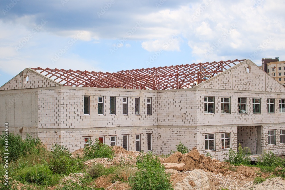 Obraz premium Advertisement on the construction site with crane