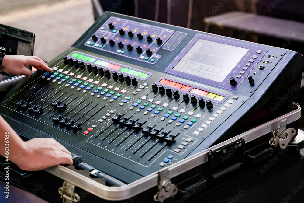 Sound engineer works with sound mixer Sound engineer works with sound mixer