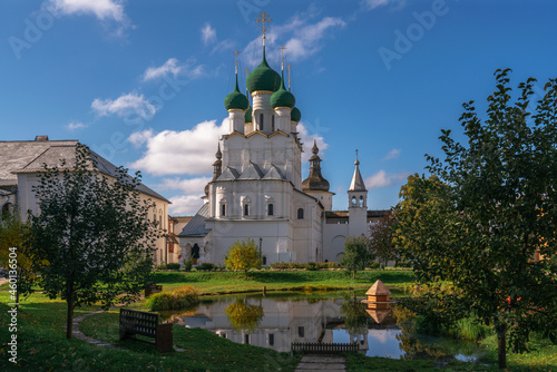 View of the Church of St. John the Evangelist from the pond in the Vladychy Dvor of the Rostov Kremlin on a sunny autumn day, Rostov Veliky, Yaroslavl region, Russia photo