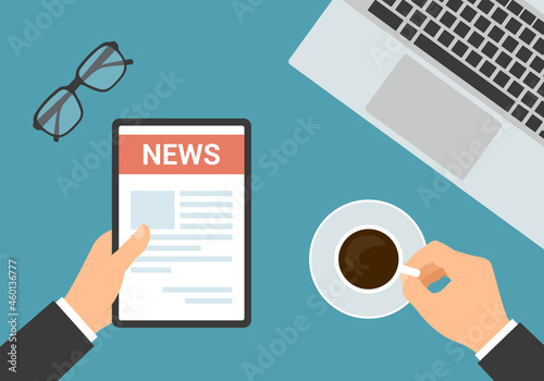 Flat design top view of office workspace. Hands of manager holding tablet with newspaper, cup of coffee and laptop, vector