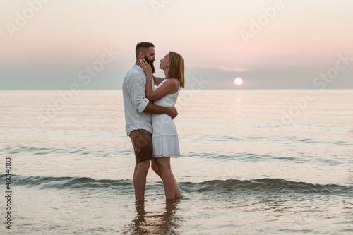 a guy and a girl on the sea. Couple love in water. people on the beach