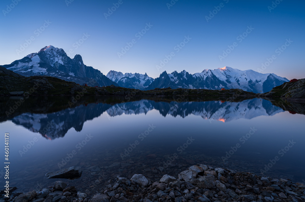 Dawn at Lac des Cheserys, with the first sunlight shining on the Mont Blanc.