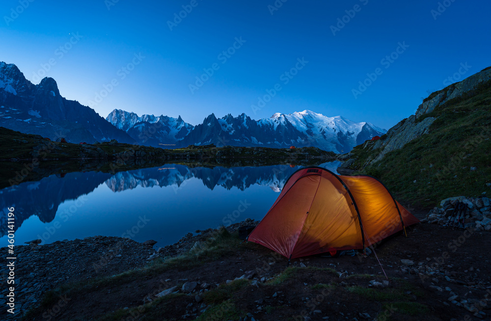 Red tents at Lac des Cheserys in the mountains near Chamonix just befor dawn.