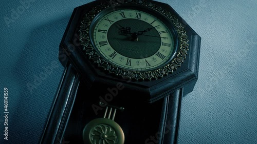 Old Wall Clock In The Dark Angled Shot