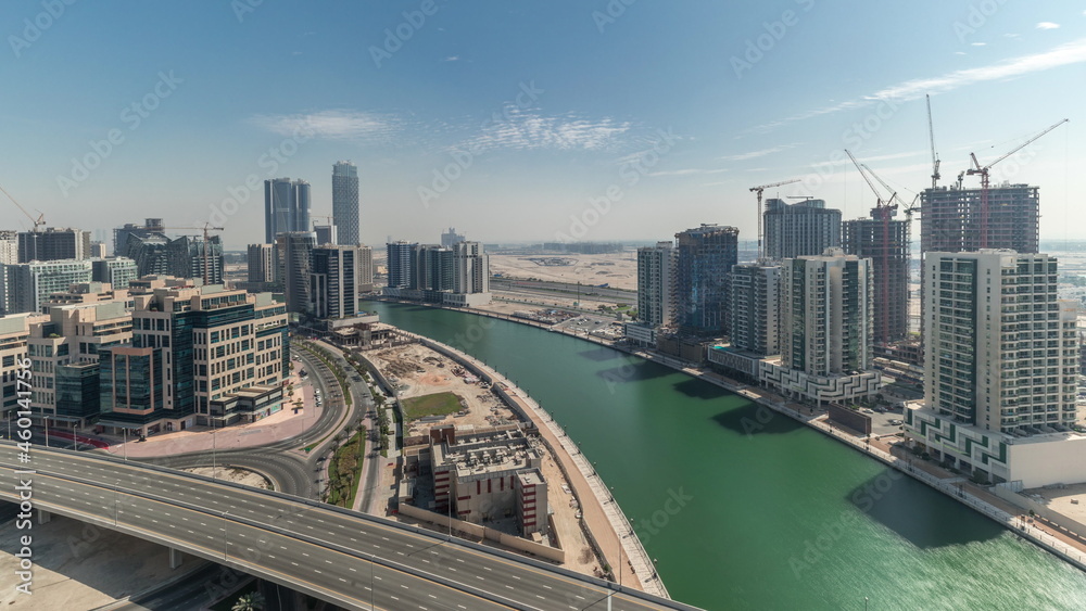 Skyscrapers at the Business Bay aerial all day timelapse in Dubai, United Arab Emirates