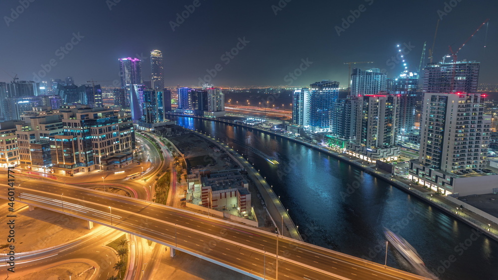 Obraz premium Skyscrapers at the Business Bay aerial night timelapse in Dubai, United Arab Emirates