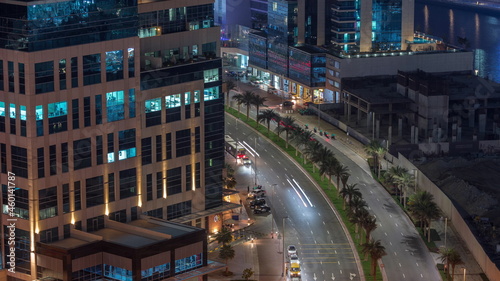 Bay Square district night timelapse with mixed use and low rise complex office buildings located in Business Bay in Dubai