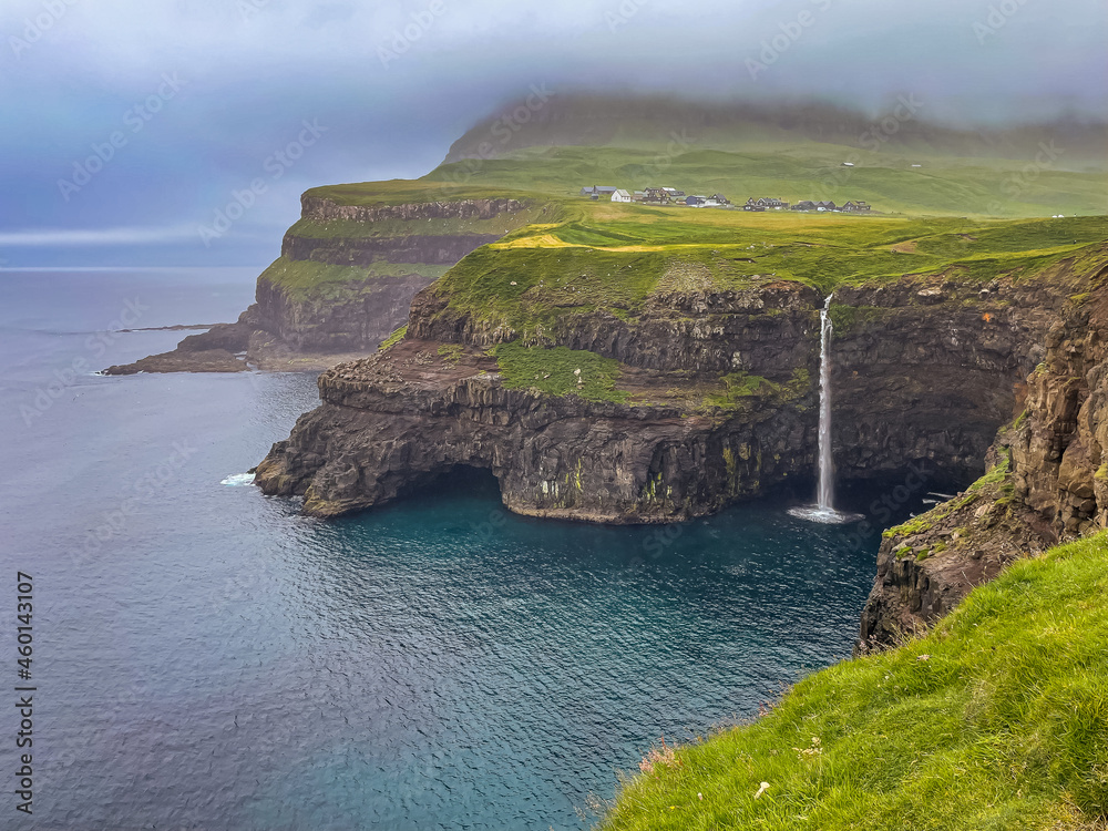 Beautiful aerial view of Gasadalur waterfall and village and landscapes in the Faroe Islands