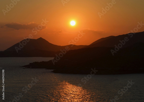 sunset over the sea and mountains