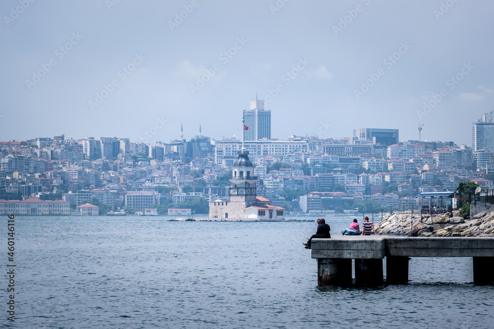 Uskudar, Istanbul, Turkey - September 2021: People watching the Maiden's Tower in Üsküdar. Istanbul's historical places. Historical Maiden's Tower and people.