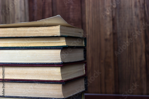 Heap of old old hardback books. Close-up of a stack of old used books