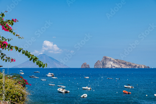 Panarea island (Aeolian archipelago), Lipari, Messina, Sicily, Italy, 08.21.2021: view of Stromboli and Basiluzzo islands. photo
