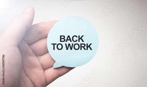back to work sign on notepad on the white backgound