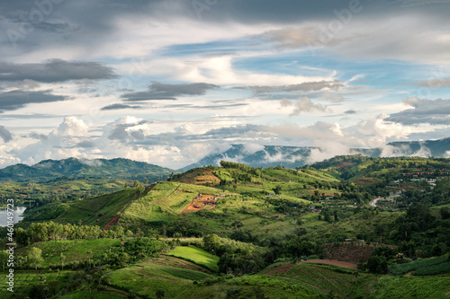 Fototapeta Naklejka Na Ścianę i Meble -  Landscape of rural agricultural hill with sunlight shine in rainy season at Khao Kho