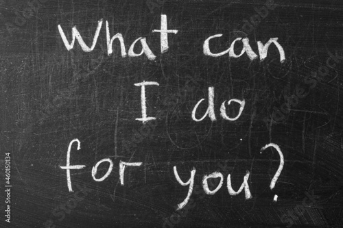 word &quot;What can I do for you&quot; written on blackboard