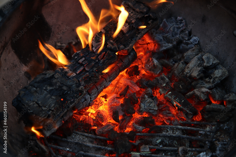 Barbecue flaming Charcoal Grill close up photo. Cooking outdoor. Beautiful flames of fire. Barbecue flaming Charcoal Grill close up photo. Cooking outdoor. Beautiful flames of fire.