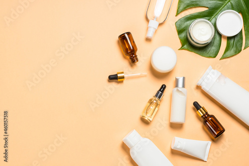 Natural cosmetic products. Serum bottles, cream, tonic and lotion for face and body care. Flat lay image.