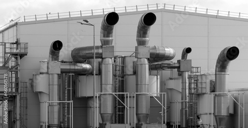 Industrial furnace and heat exchanger is cracking hydrocarbons in factory with monotone, Close up of equipment in petrochemical plant on sky background with black and white