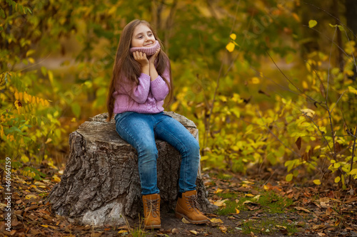 autumn outdoor portrait of beautiful happy child girl