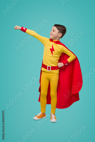 Obraz na plátne Courageous superhero kid in colorful costume