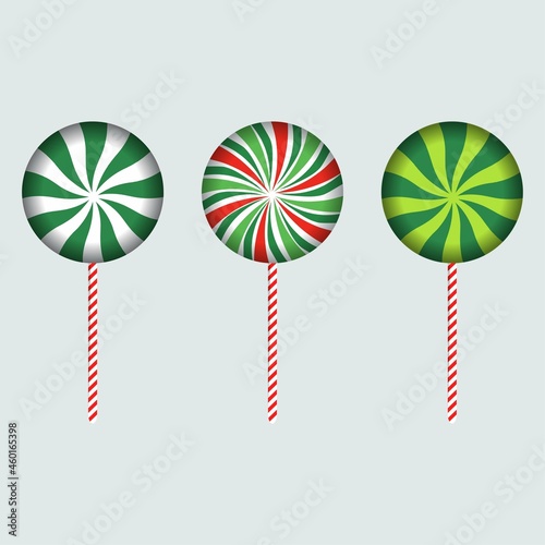 Christmas round candy with red, off-white, pink, and lime color strips. Round candy design on an ash background. Set of three Christmas candies. Christmas candy vector design collection for kids.Chris