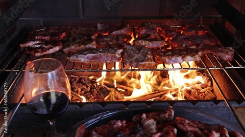 video with red wine and meat on fire preparation