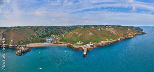 Panoramic aerial drone view of Bouley Bay and adjacent coast line in the sunshine. Jersey, Channel Islands